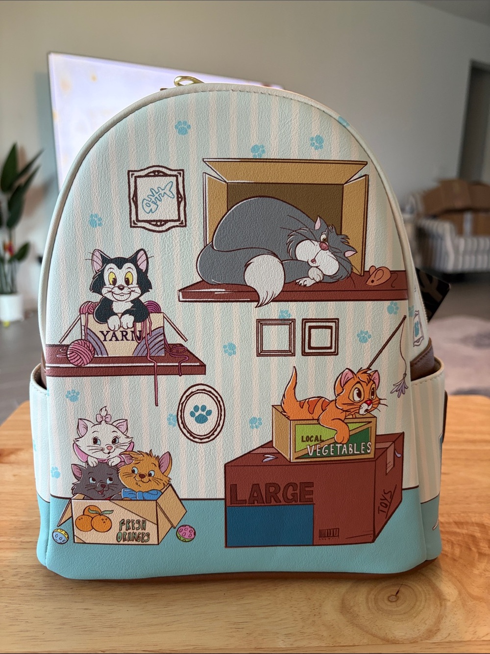 Loungefly Light Blue Cartoon Cats Backpack with Multicolor Accents